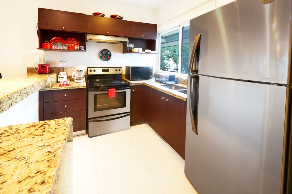 Family Condo, Multiple Beds, Non Smoking | Private kitchen | Fridge, coffee/tea maker, cookware/dishes/utensils, dining tables