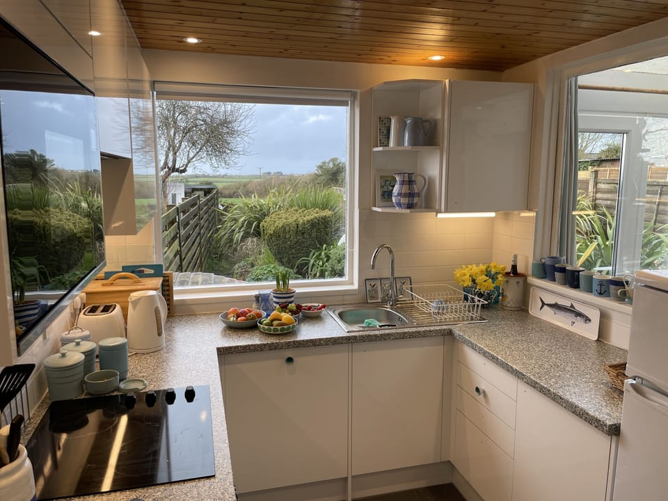 Brand new kitchen with plenty of crockery and glasses