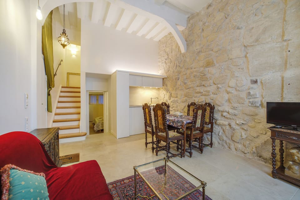 The dining area and kitchen. View of stairs (9 steps) to the upper bedroom.