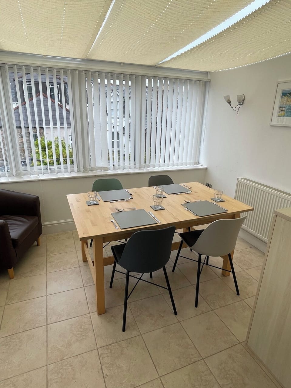 Light and warm conservatory dining area, open plan to living space.