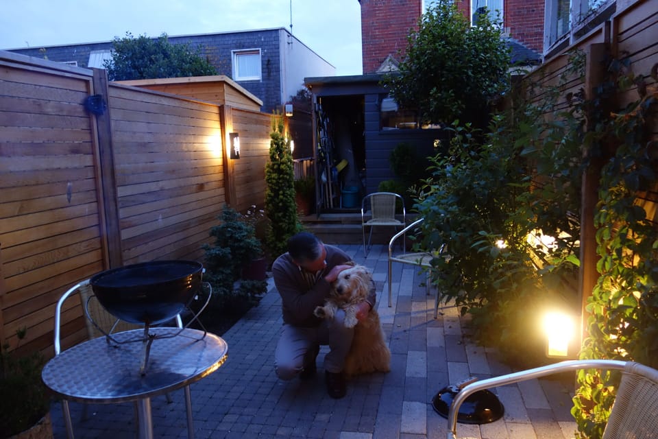 Mungo and Iain in back garden preparing barbecue
