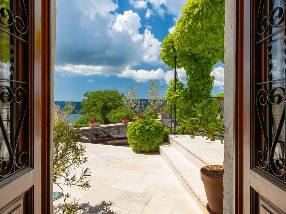 Flowerpot, Flagstone, Garden, Shade, Houseplant, Chair, Landscaping, Outdoor Furniture, Stone Wall, Eco Hotel