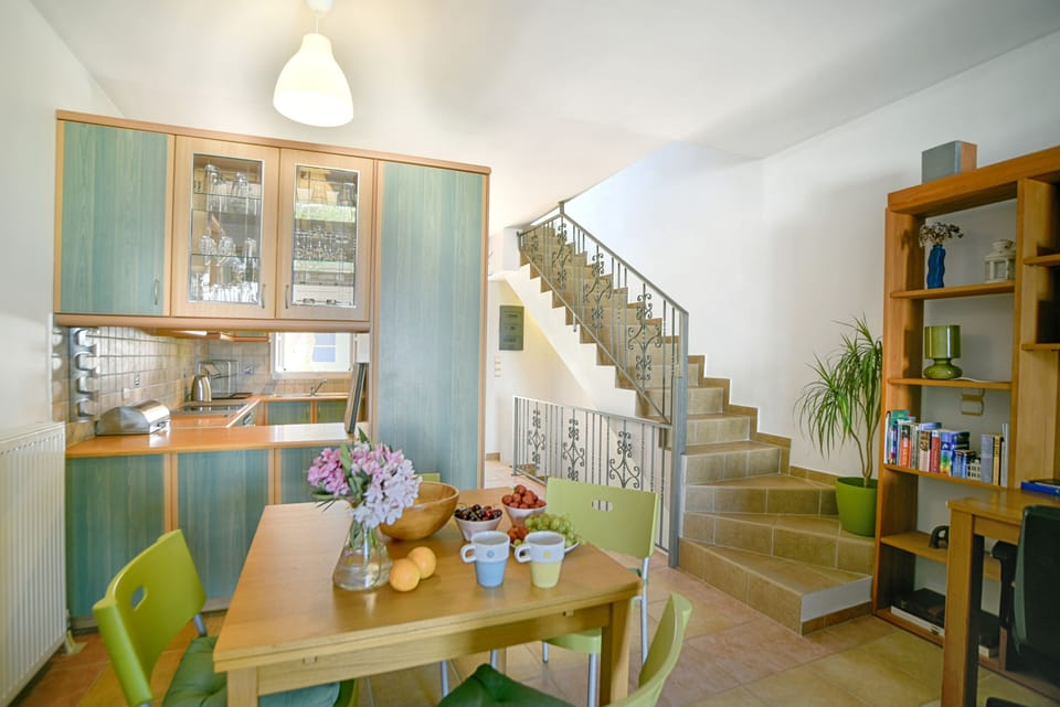 THE KITCHEN AND DINING AREA WITH SEATING FOR 8 PEOPLE