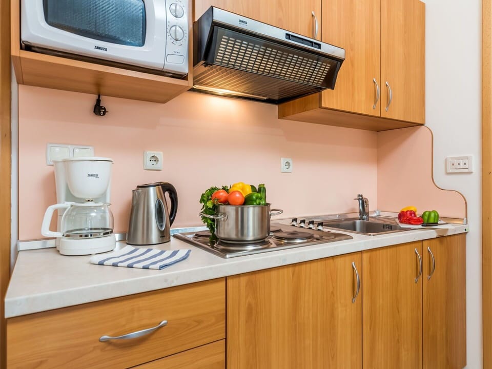 Countertop, Cabinetry, Room, Kitchen, Furniture, Property, Major Appliance, Microwave Oven, Small Appliance, Drawer