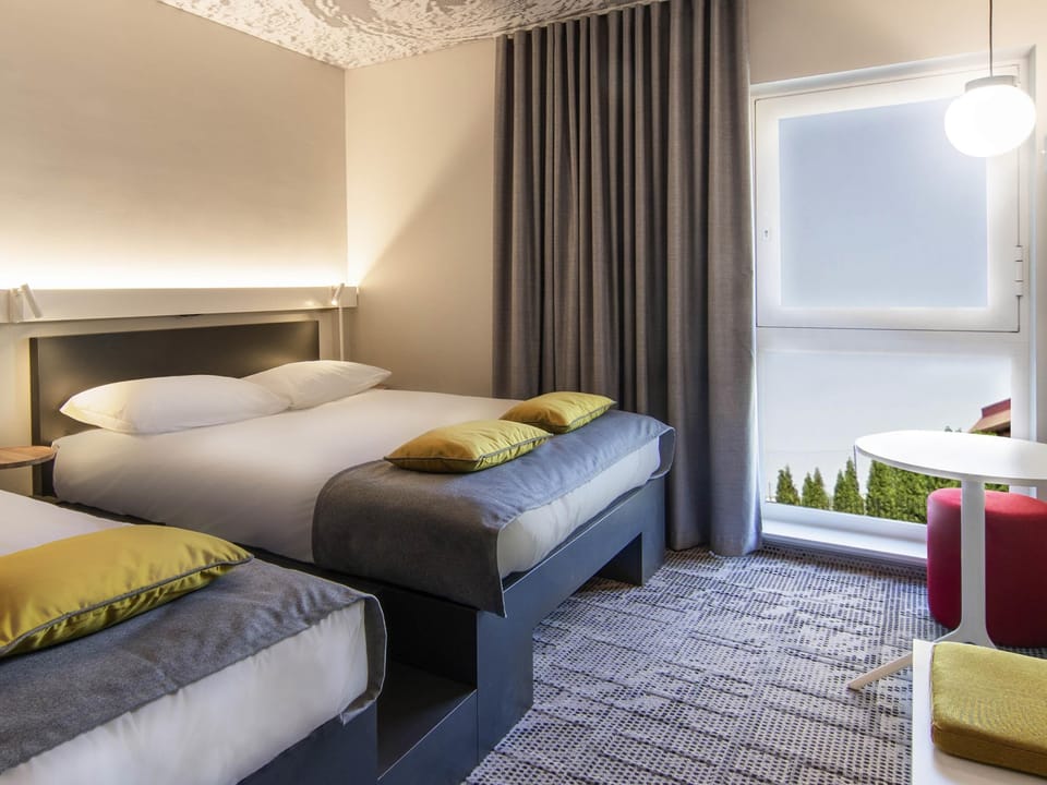 Triple Room, Multiple Beds | In-room safe, blackout drapes, soundproofing, iron/ironing board