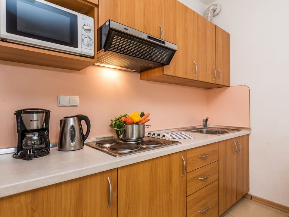 Countertop, Cabinetry, Property, Room, Kitchen, Furniture, Major Appliance, Microwave Oven, Yellow, Small Appliance