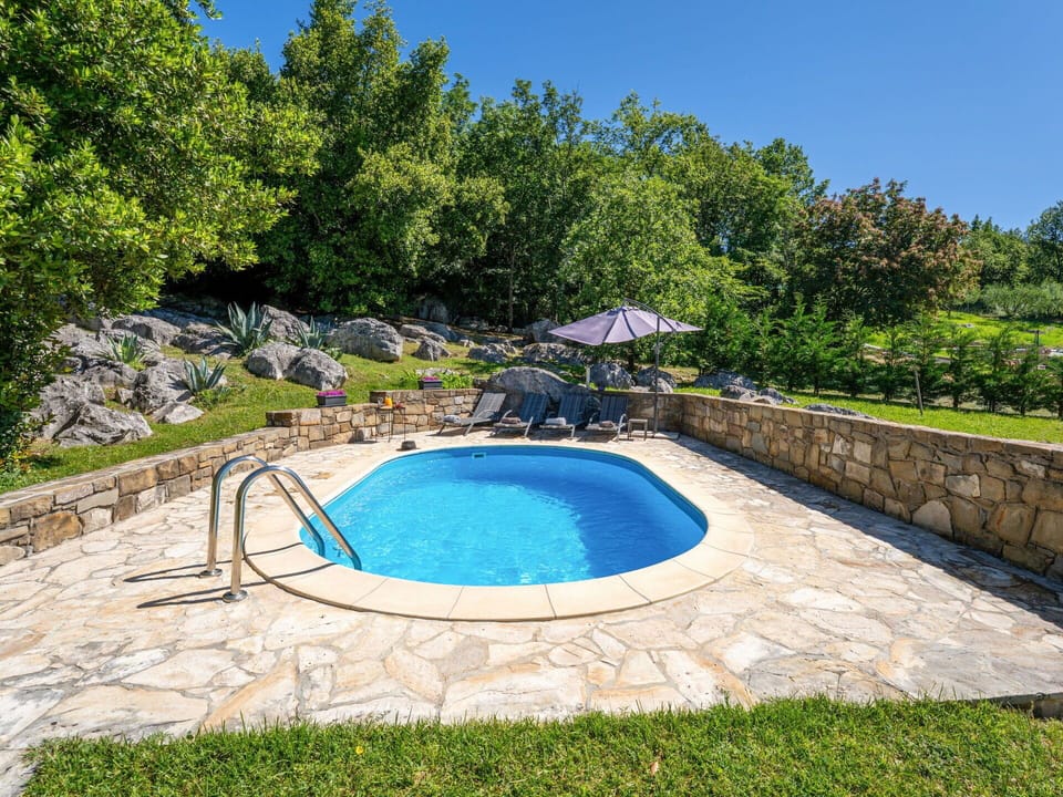 Swimming Pool, Rock, Flagstone, Composite Material, Stone Wall, Outdoor Furniture, Shade, Cobblestone, Landscaping, Water Feature