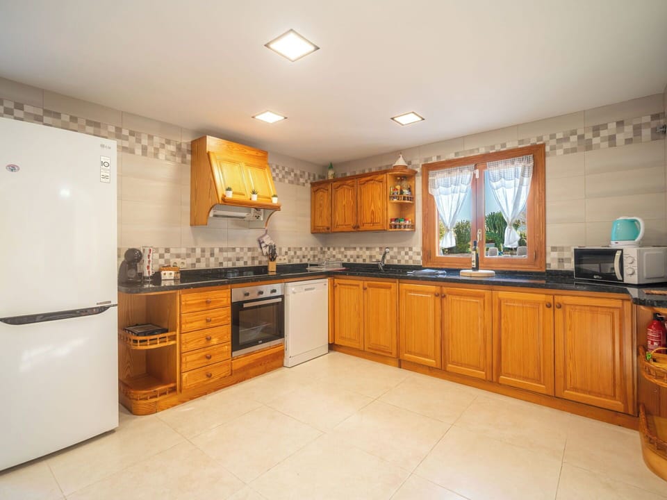 Kitchen, Cabinetry, Kitchen Appliance, Countertop, Major Appliance, Flooring, Interior Design, Wood, Floor, Furniture