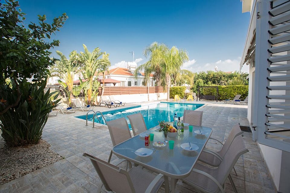 Outside dining area with table and chairs to seat 6 people
