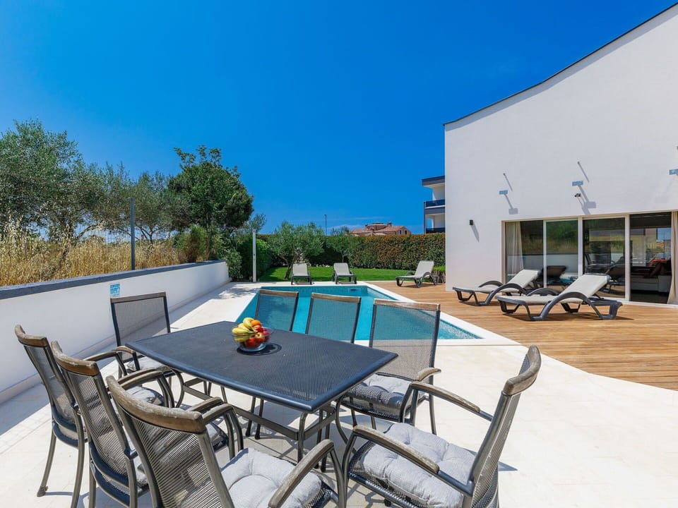 Table, Sky, Furniture, Chair, Azure, Outdoor Table, Outdoor Furniture, Shade, Swimming Pool, Building