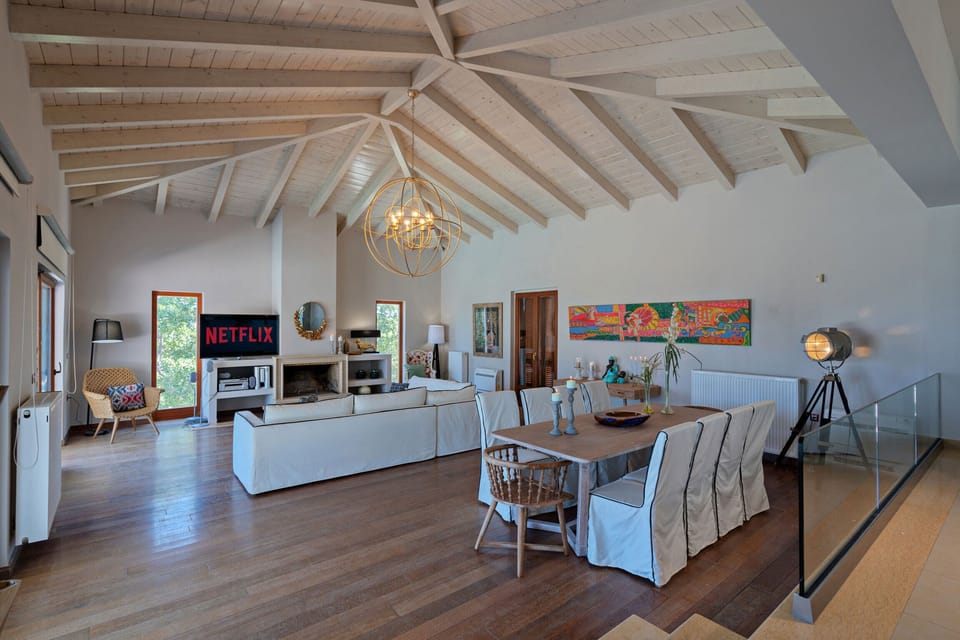 Open plan area with sitting and dining area.