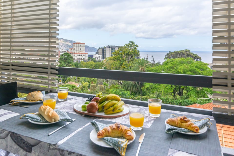 Kitchen Balcony includes small table to enjoy the view. 