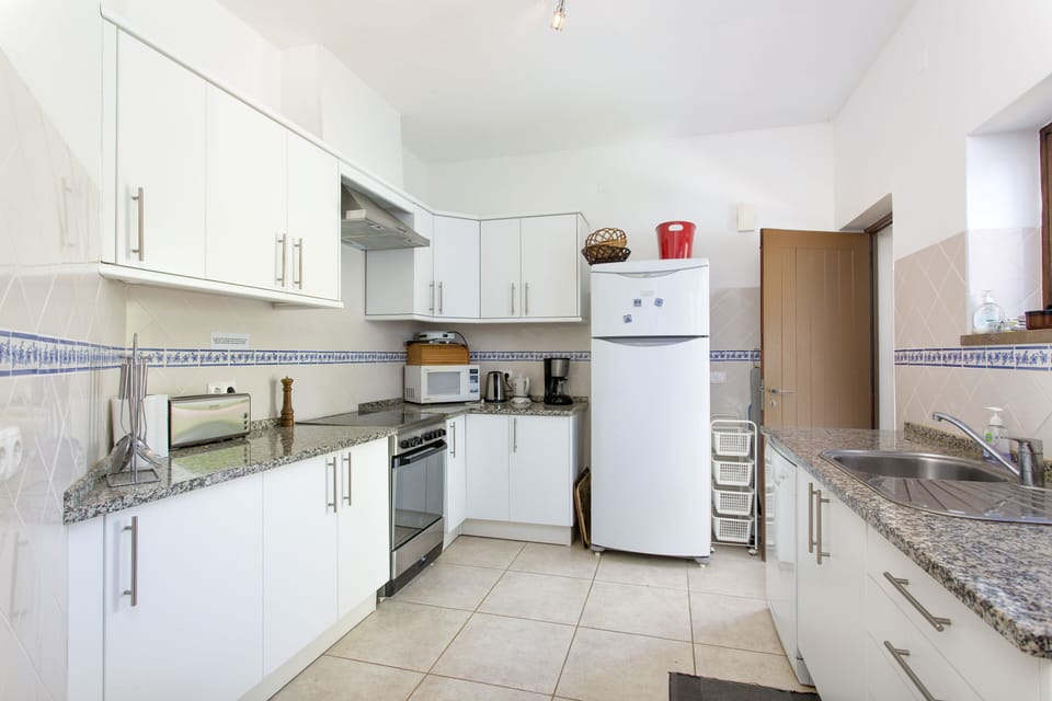 Fully equipped kitchen with dishwasher. Washing machine in outside utility room