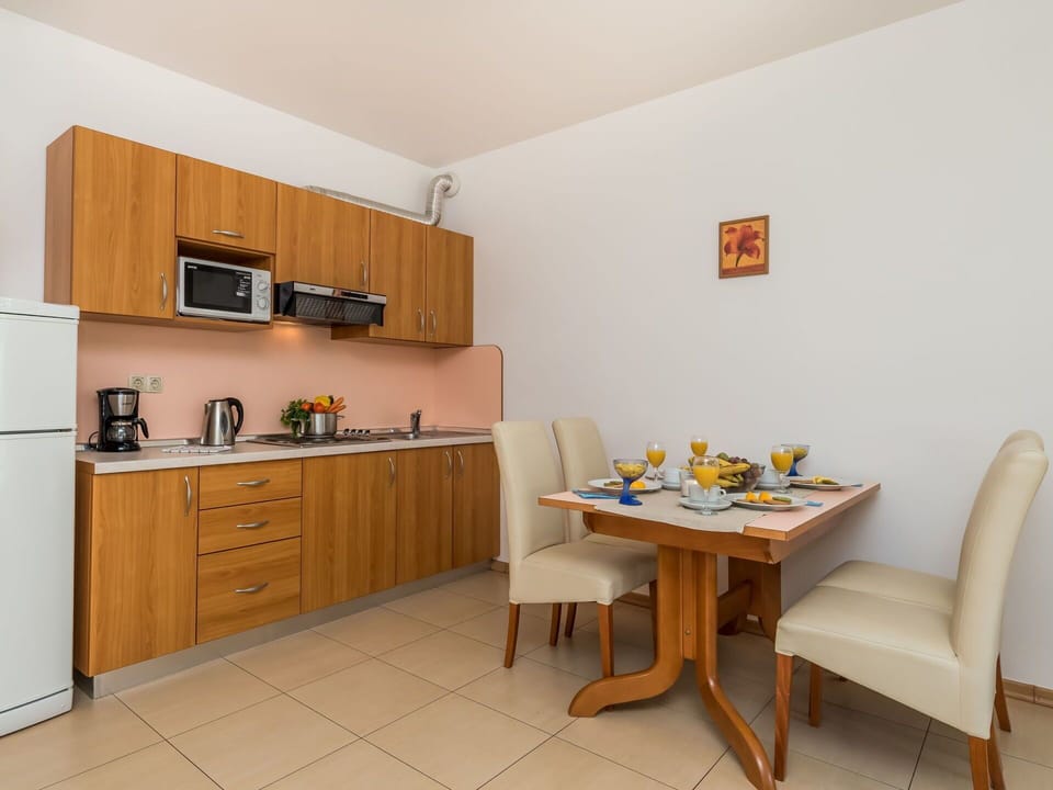 Room, Furniture, Property, Interior Design, Kitchen, Building, Yellow, Cabinetry, Floor, House