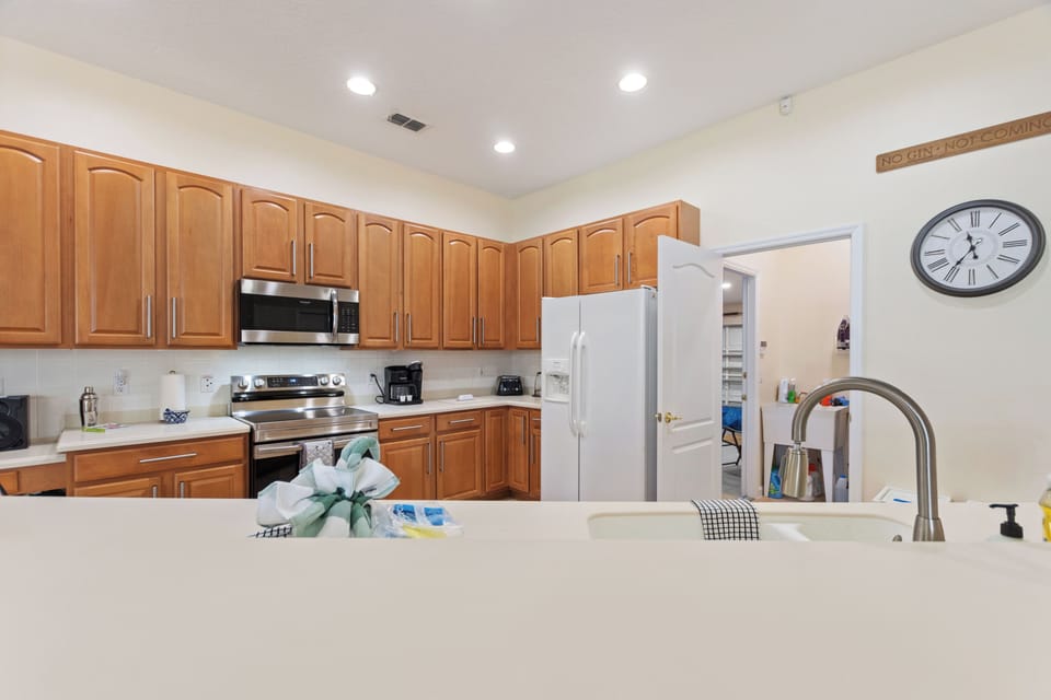 Kitchen showing doorway to laundry room.