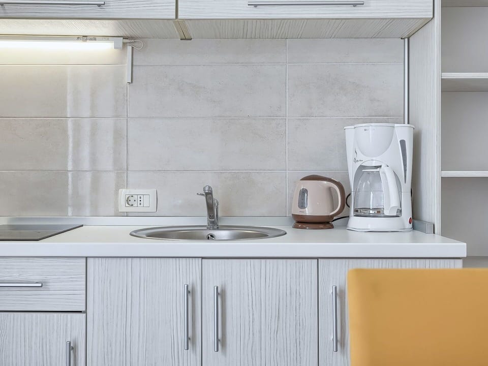 Countertop, Tile, Room, Property, Cabinetry, Furniture, Kitchen, Tap, Interior Design, Sink
