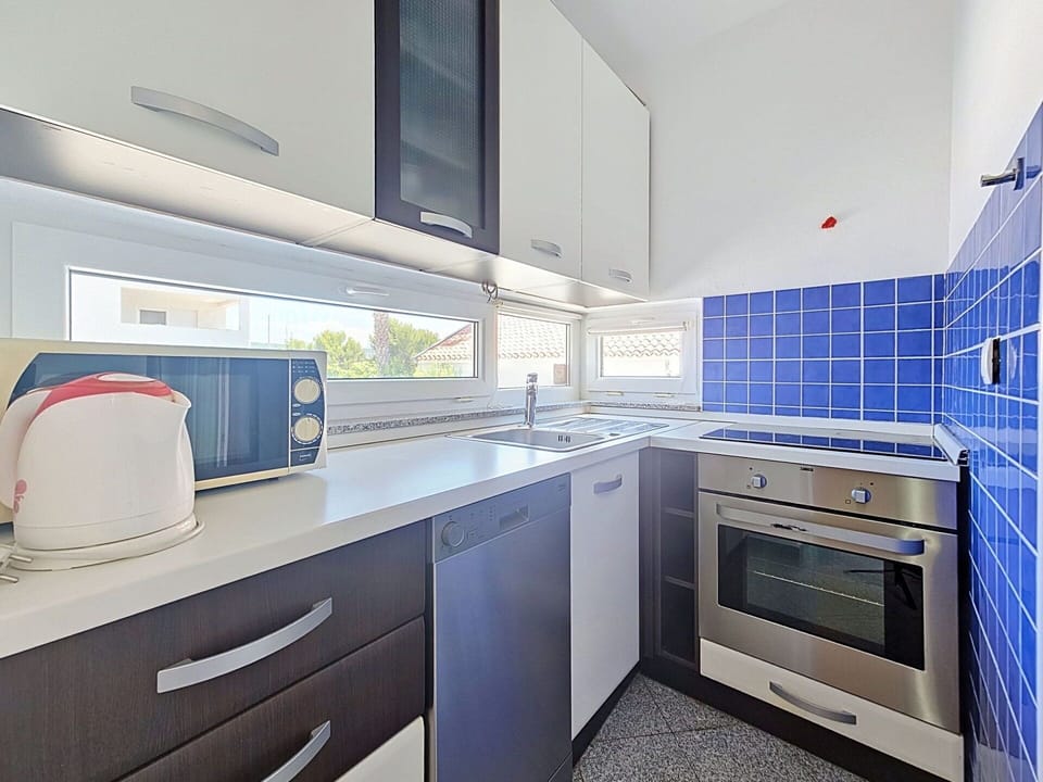 Kitchen, Countertop, Flooring, Interior Design, Major Appliance, Kitchen Appliance, Floor, Ceiling, Home, Plumbing Fixture