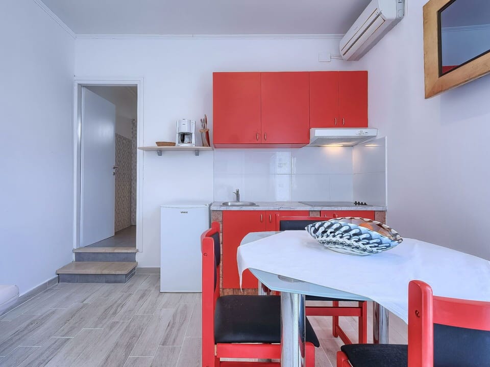 Room, Furniture, Red, Property, Orange, Interior Design, Building, House, Floor, Table