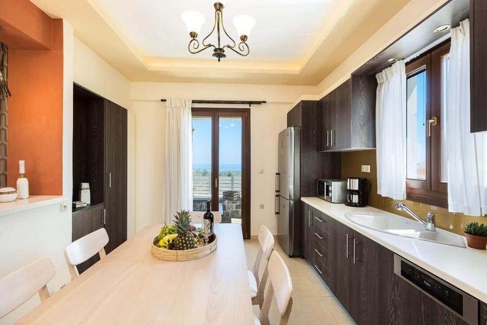 A modern kitchen with dining table, perfect for cooking and enjoying meals together.