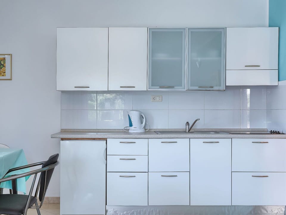 Countertop, Cabinetry, Room, White, Furniture, Kitchen, Property, Turquoise, Cupboard, Interior Design