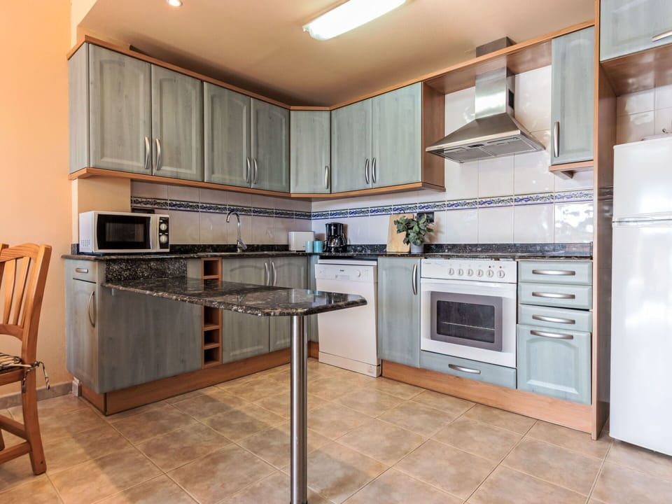 Kitchen, Kitchen Appliance, Countertop, Cabinetry, Flooring, Major Appliance, Furniture, Wood, Floor, Interior Design