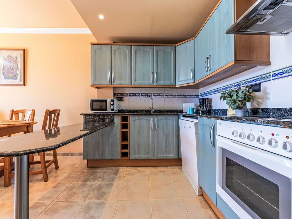 Kitchen, Flooring, Wood, Floor, Major Appliance, Interior Design, Countertop, Kitchen Appliance, Cabinetry, Furniture