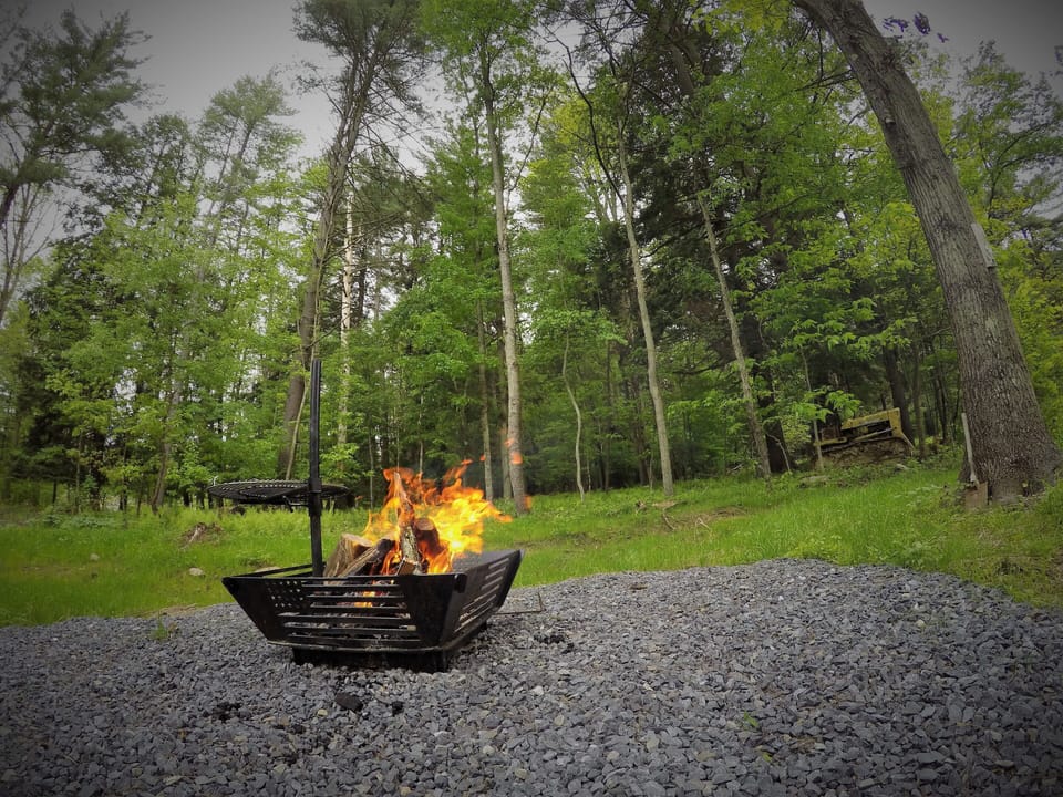 Enjoy cooking over an open fire with our custom built fire pit