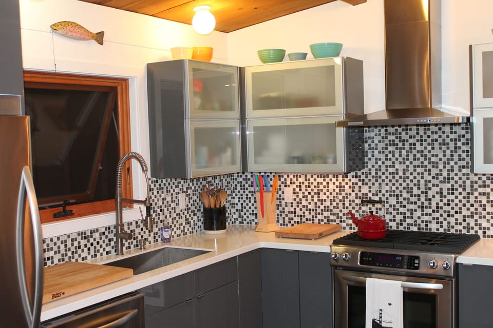 Kitchen details: large cutting boards, gas stove