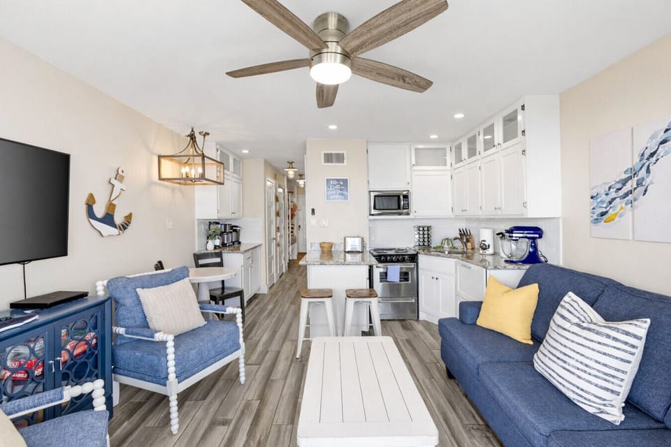 Keep everyone together, even on busy weekends—open living room to kitchen and hallway in this family-friendly Casa del Mar condo.
