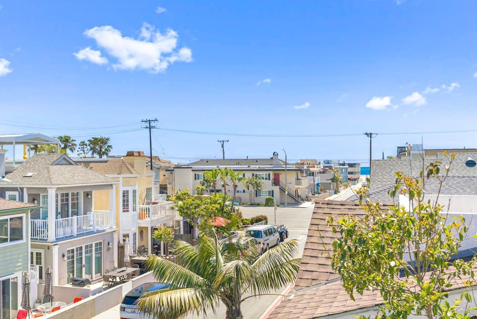 View from the front Juliet balcony, where you can catch the ocean breezes and even an ocean view!
                