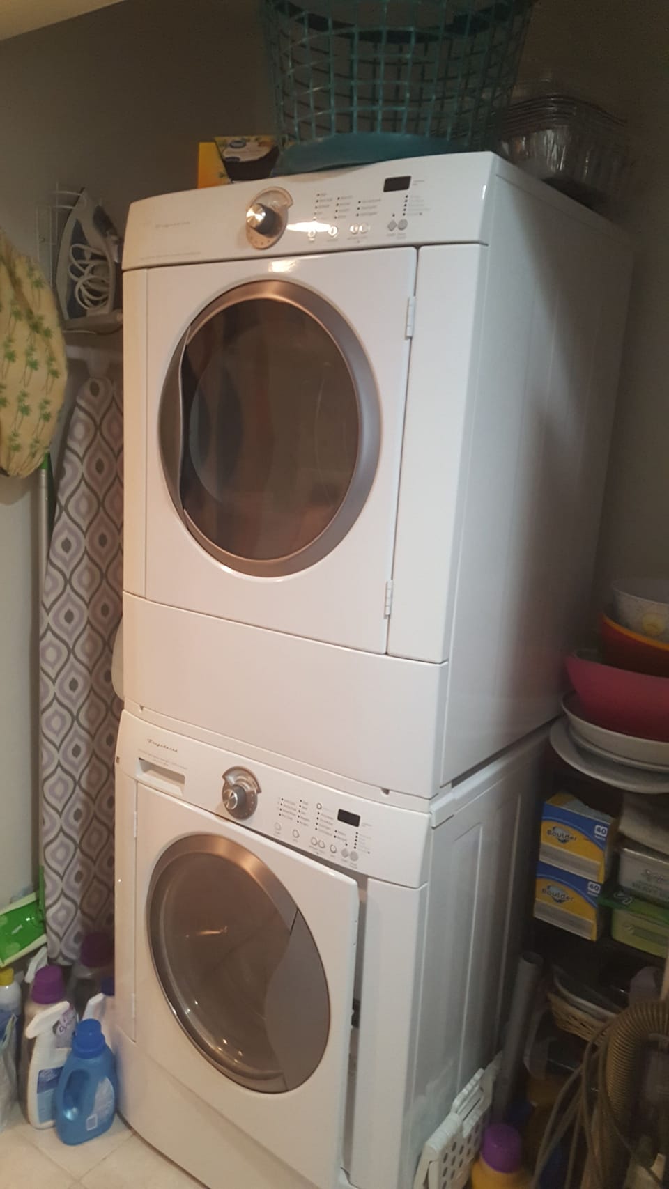 Full sized washer and dryer, iron and board in utility closet 