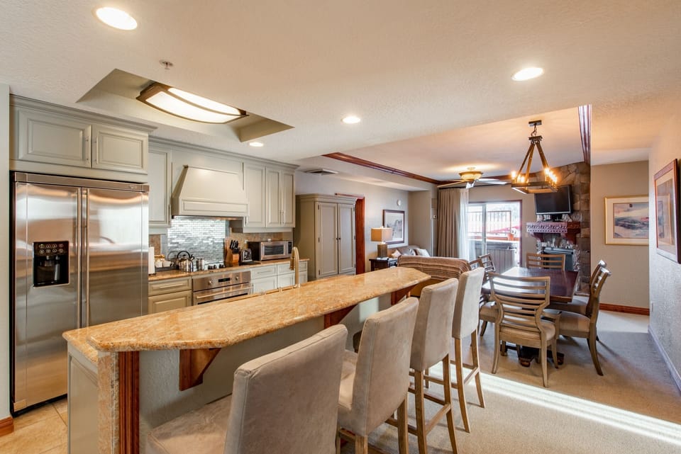 Remodeled  Kitchen with room for Four at the Bar and Dining Table for Six.