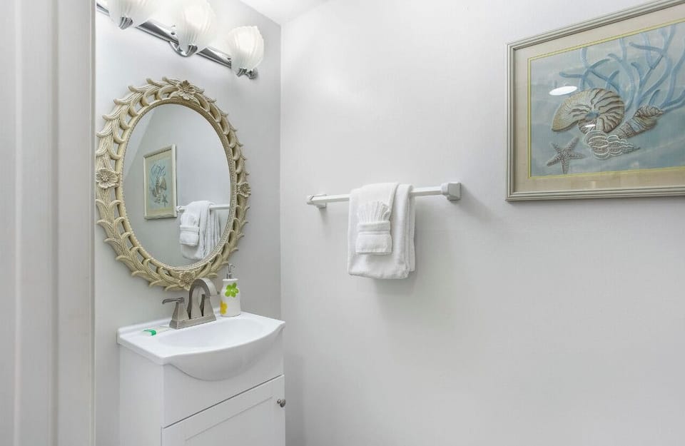View of half bathroom located downstairs for your convenience