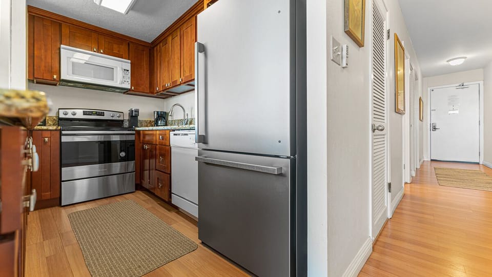 Clean white and stainless steel appliances.