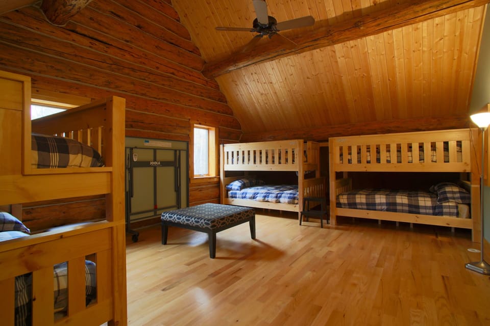 Enormous bunk room with three identical twin/full bunk beds 