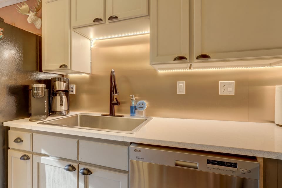 Two coffee makers: one percolator and one Keurig