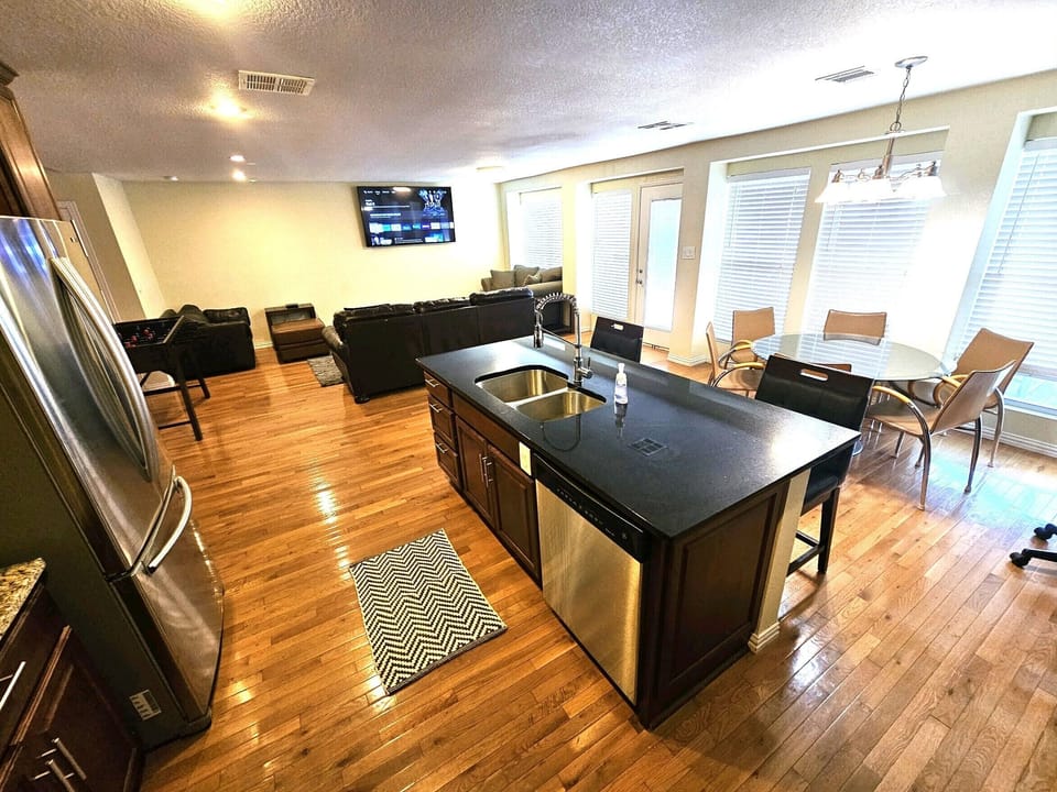 View of the family room 70" smart TV & dedicated study table.