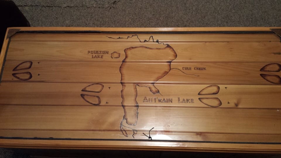 Living room coffee table with map of the lake.