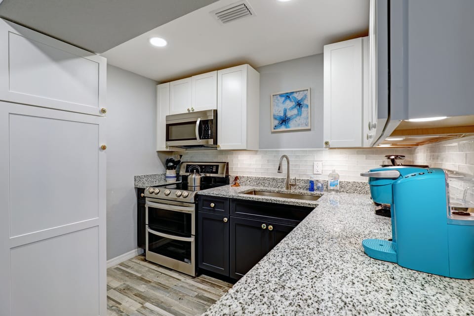 kitchen area and stove and microwave