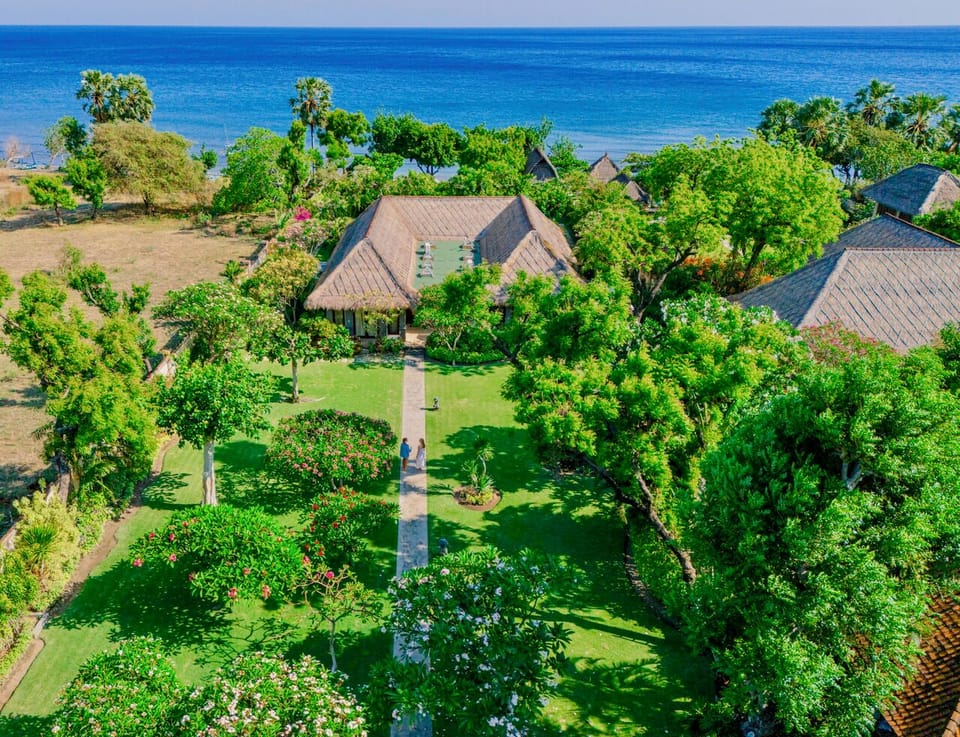 Lush gardens meet the ocean at Villa Wilali.