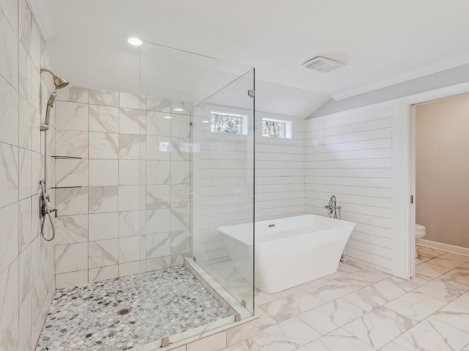 Renovated Master Bathroom with Separate Tub and Shower at 2 Red Cardinal