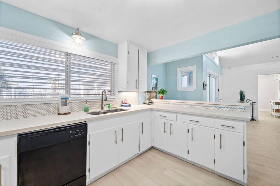 Elevate your dining experience in this well-appointed kitchen, featuring chic bar seating for a casual and inviting atmosphere