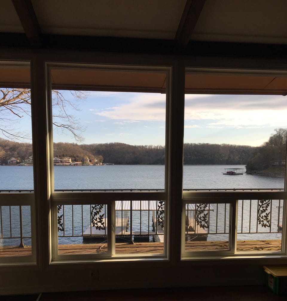 Morning view from living room.  12 concrete steps to lake. Very gradual slope. 