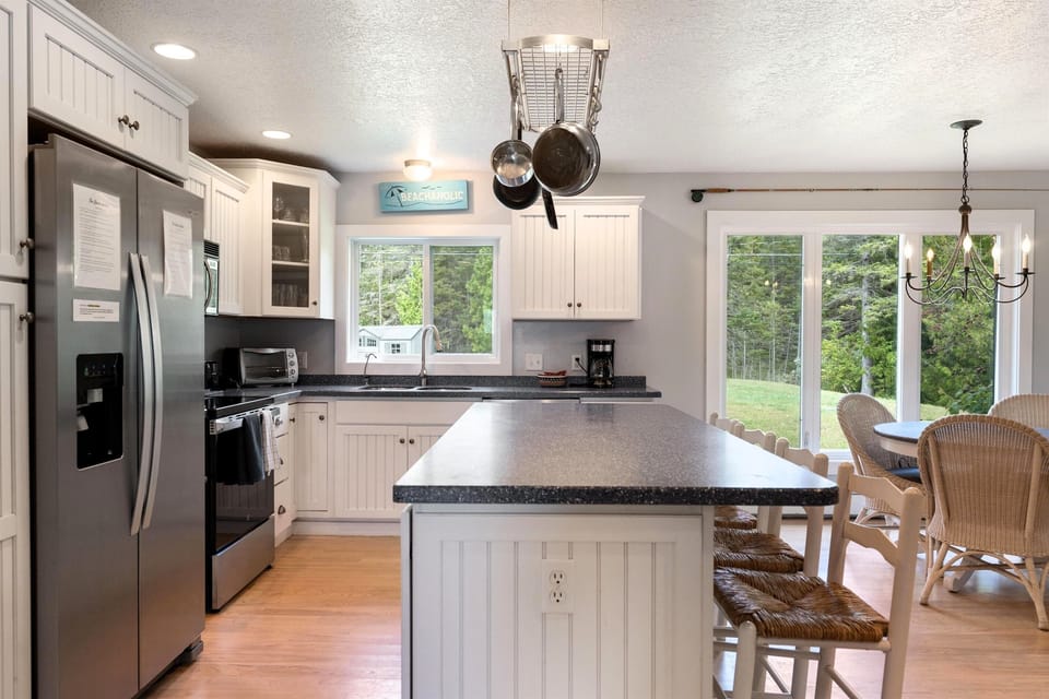 Kitchen has new Quartz counters, picture of old counter tops
