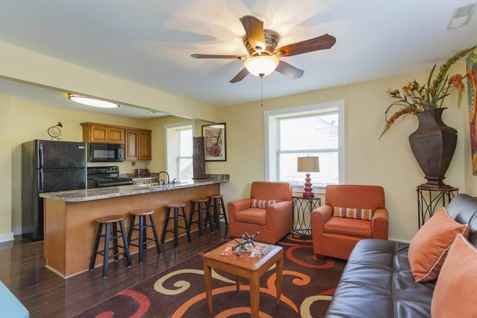 Upstairs living room with kitchen view