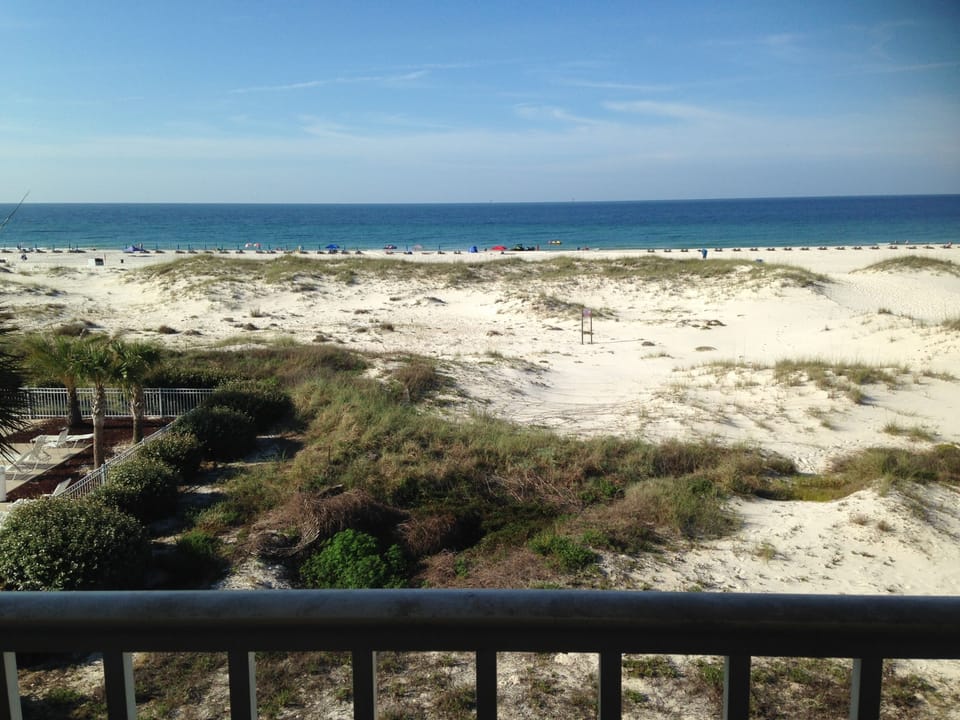 Beach and Gulf view from our balcony; watch the sunrise and set!