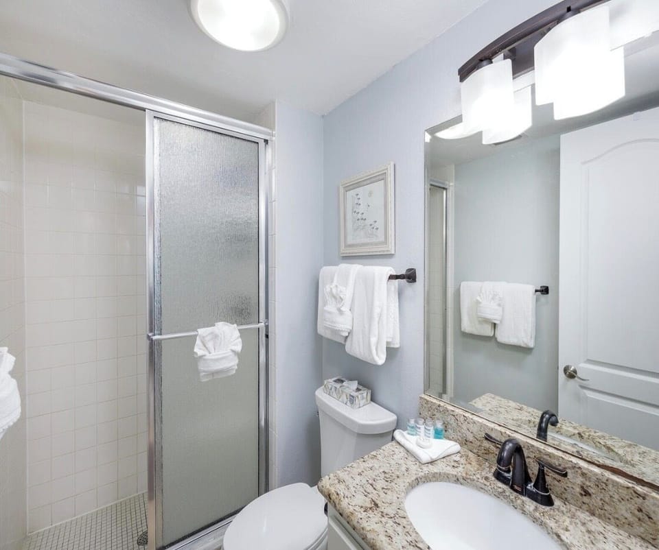Full bath next to guest room. Walk in shower w grab bars.   