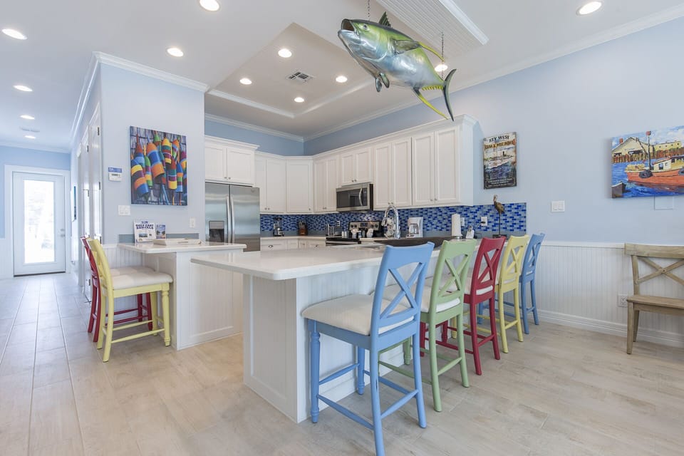 Spacious kitchen fully equipped with kitchen utensils and extra seating!