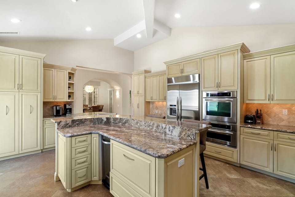 Large island for casual gatherings; Under island pull out fridge for drinks