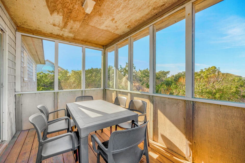Your private screened porch offers peaceful dining with garden views and gentle breezes flowing through.